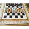 Шахматный стол с резными деревянными фигурами и два пуфика
